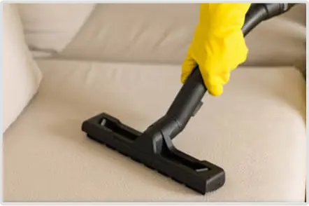 cleaning couch yellow gloves